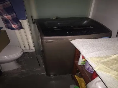 滚筒洗衣机排污口堵塞怎么拆开(图1)