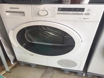 洗衣机洗衣服总是掉黑色的毛(图1)